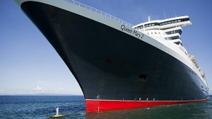 Captain Kevin Oprey poses on Queen Mary 2's Bulbous Bow - FreeShipPlans.com